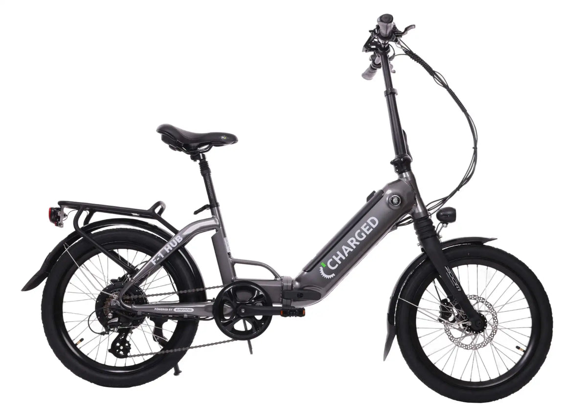 Folding electric bike with grey 6061 alloy frame, 20-inch black tires, hydraulic disc brakes, and rear carrier rack.