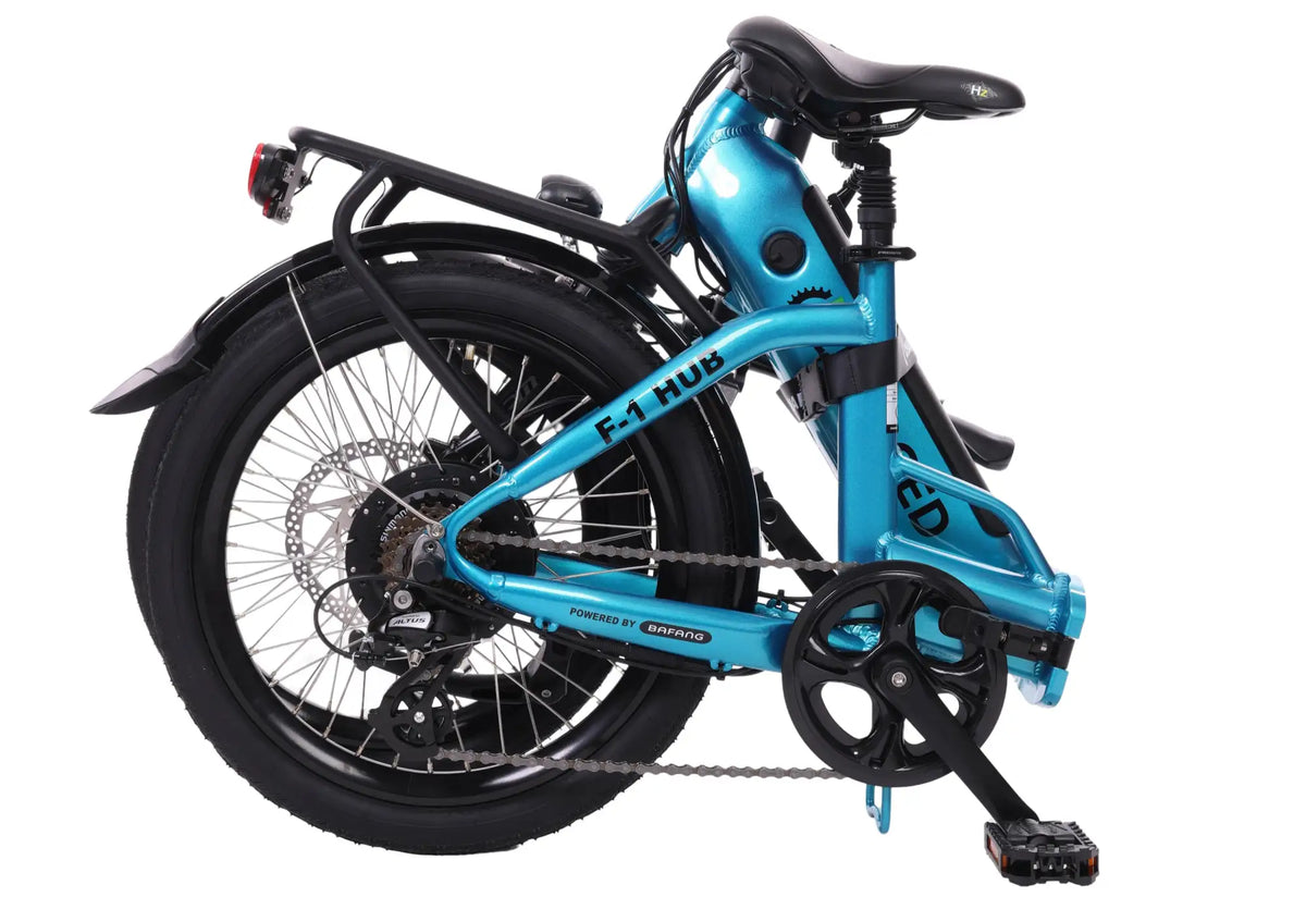 A sleek, turquoise-blue foldable electric bicycle with black tires and components.